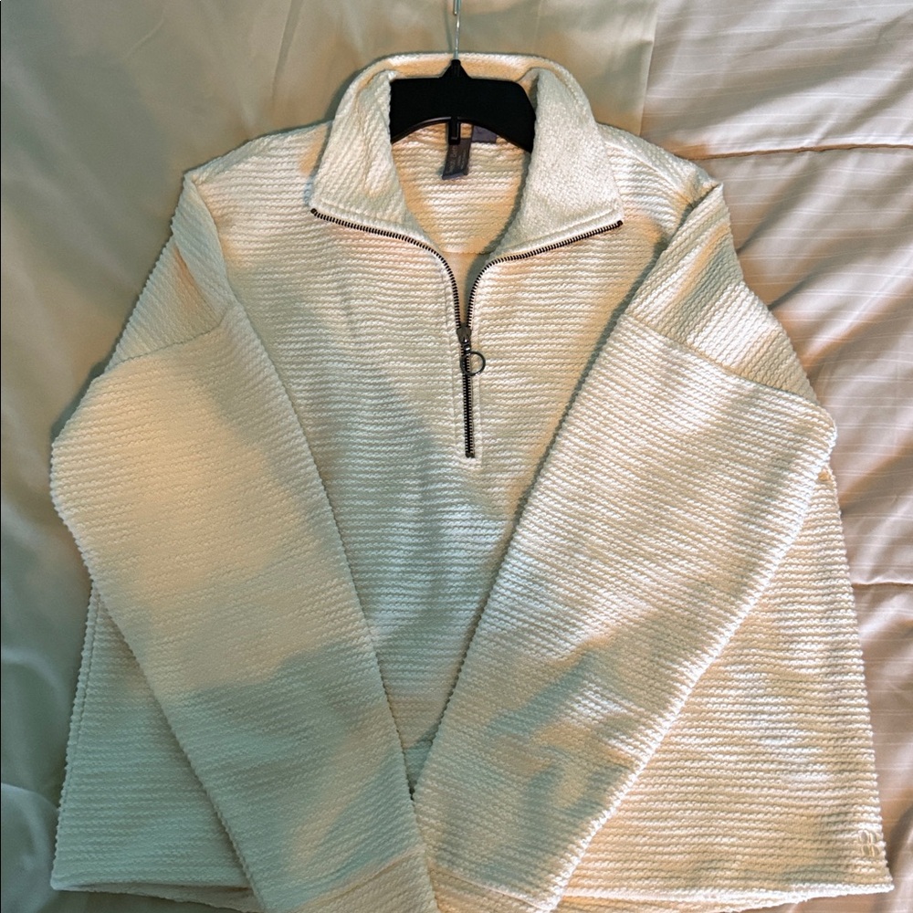Sweaty Betty New without tags. Off-White Quarter zip top.